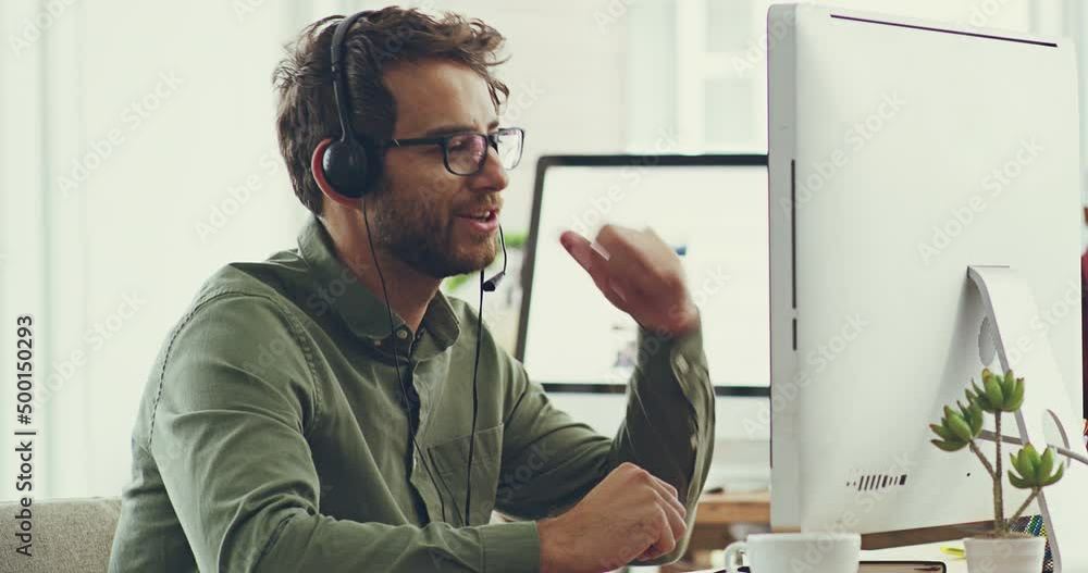 Aufkleber Working to find you a solution. Handsome cheerful young caucasian male call center support agent working on his computer while wearing a headset listening to customers and trying to solve problems