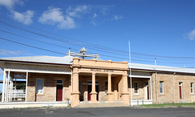 Fototapeta na wymiar Railway yard and station in the Queensland town of Warwick in Southern Downs Region, featuring buildings, silos and carriages