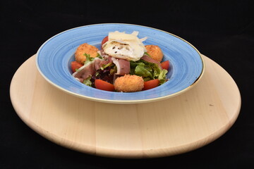 salad with tomatoes, smoked ham,cheese and mayonnaise