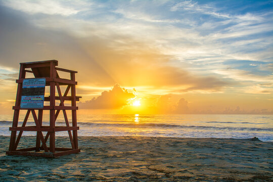 Sunrise at the beach in Cocoa Beach, Florida near Cape Canaveral. Brevard County also known as the Space Coast. 