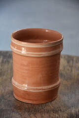 Obraz premium ceramic terracotta jug ,Artistic handmade ceramic clay brown terracotta pots from Bistrita, Romania