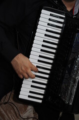 Musician playing on the keyboard synthesizer piano keys