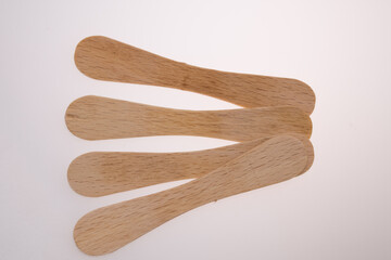 Wooden ice-cream sticks on white background