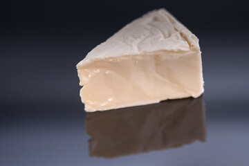 Cheese triangles on a reflective surface,Processed cheese