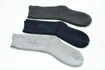  Three pair of male socks isolated on a white backgrounda