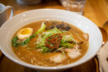 Close-up of miso ramen bowl, topped with Japanese charsiu and soft egg