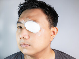 Asian men wear gauze blindfolds, sun protection, dust protection, masks after treatment or surgery,...