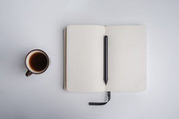 Coffee cup and notebook