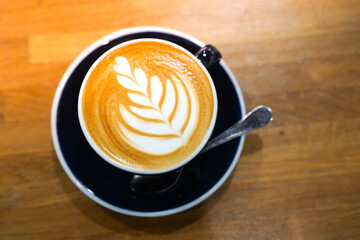 Latte coffee on wood table