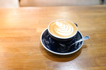 Latte coffee on wood table