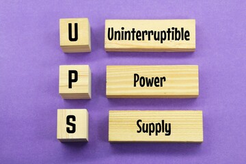 wooden cubes with the letters UPS or the word uninterruptible power supply
