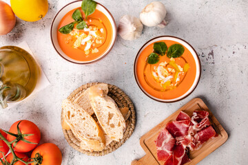 Fototapeta na wymiar Salmorejo Soup With Ham And Eggs In A Bowl. Top view and copy space