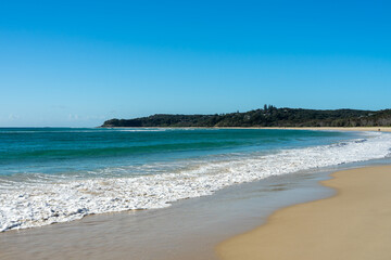 Fototapeta premium View across the water from Home Beach to Cylinder Headland, Point Lookout, Stradbroke Island, Queensland, Australia. 
