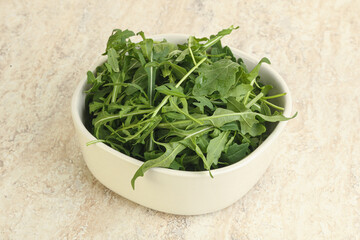 Fresh green arugula in the bowl