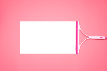 The pink glass wiper wipes the pink background in the middle of the picture with white spaces to be...