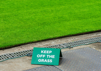 Keep of the grass sign at Wimbledon court 