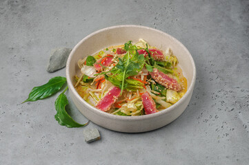 tuna salad with ponzu sauce on gray background