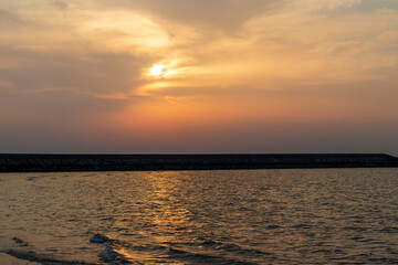 Shot of a dramatic sunset by the beach. Nature