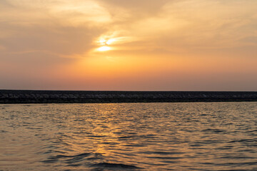 Shot of a dramatic sunset by the beach. Nature