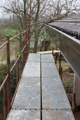 Detail of a scaffolding at a residential building for to replace tiles and gutter 