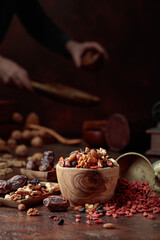 Various dried fruits and nuts on a kitchen table.