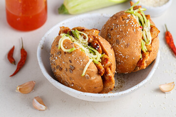 Delicatessen sandwiches made of whole-grain buns with fried turkey or chicken, zucchini salad and hot sauce with sesame and sunflower seeds. Healthy fast food. Selective focus