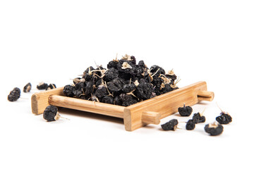 Black wolfberry or black goji berries isolated on white background