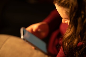 Girl in her phone at night