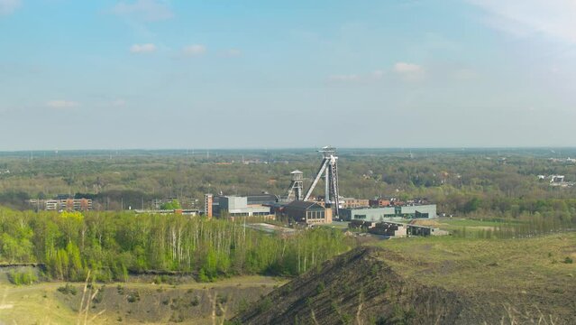 Old mining towers and shafts in Belgium landscape. Distance view from mining heap