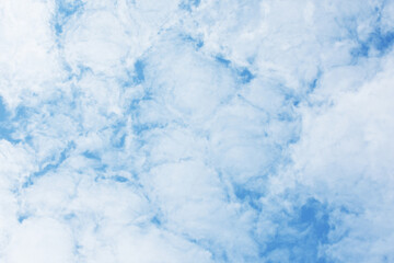 Blue sky scenery with white fluffy clouds for the background.