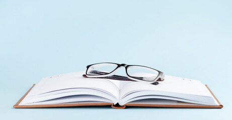 Notepad over blue background