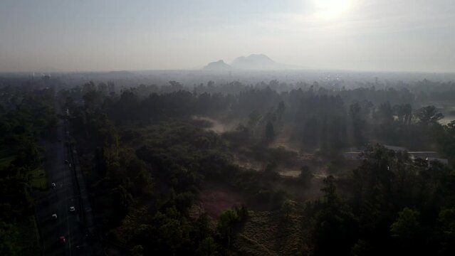 Aerial shot of an Mexico city avenue with fog