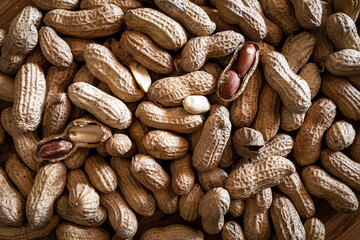 Peanuts in their shells. Texture background with peanuts