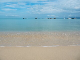 Sea sand sun clean beach with bright sky and white cloud at Samui Thailand