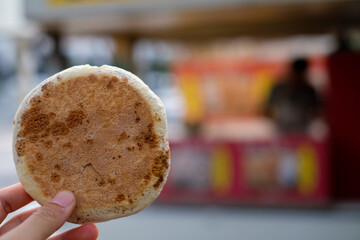 hand holding a cup of coffee