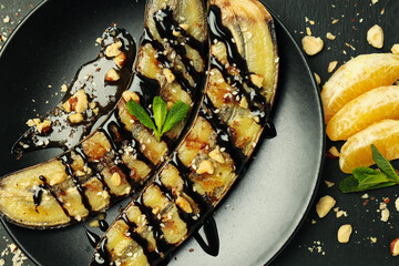 Concept of tasty dessert, grilled banana, close up