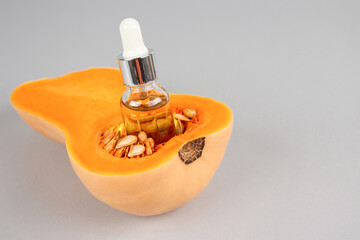 Dropper bottle with natural organic pumpkin seeds cosmetic oil - natural oil extract for skincare...