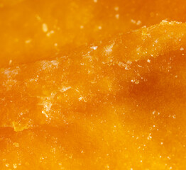 Fototapeta na wymiar Dried yellow mango pulp as background.