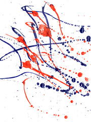 Drops of red and blue paint on a white background.