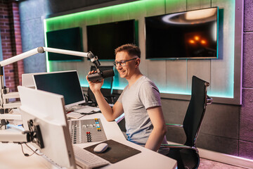 The DJ hosts the program and communicates with the audience on air at the radio station. The...