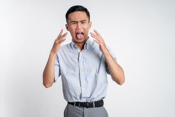 portrait of asian young man with disgusting expression isolated over white background