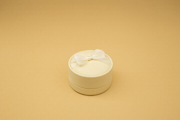Beige jewelry box on beige background