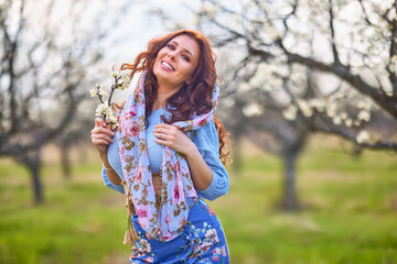 portrait of a beautiful brunette woman in spring nature.