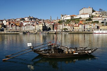 Porto panoramic view and traditional port wine transport boat on the Douro - Portugal 