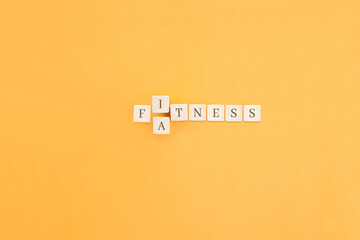 Changing the word made up of cubes with letters, turning Fitness word into Fatness