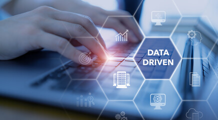 Data driven marketing concept. Big data analytics, personalized and contextual marketing. Marketing technology.  Working on computer cubes with data driven surrounded with analytics methodology icons.