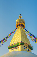 Naklejka premium The golden spire of Bodhnath Stupa, Kathmandu, Nepal, with Buddhist prayer flags