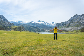 A young tourist visiting Lake Ercina in the Lakes of Covadonga. Asturias. Spain