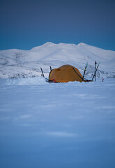 Tent in the snow on a wintertrip over the famous Kungsleden in Sweden.