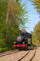 Fototapeta premium Old steam locomotive driving on the railway